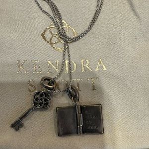 Kendra Scott Silver Charm Necklace. Adjustable Length with key and book charm.